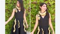 أمريكية تصمم فستاناً بـثعابين موصولة بالذكاء الاصطناعي